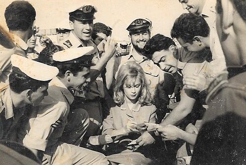 Signing autographs for sailors, 1964